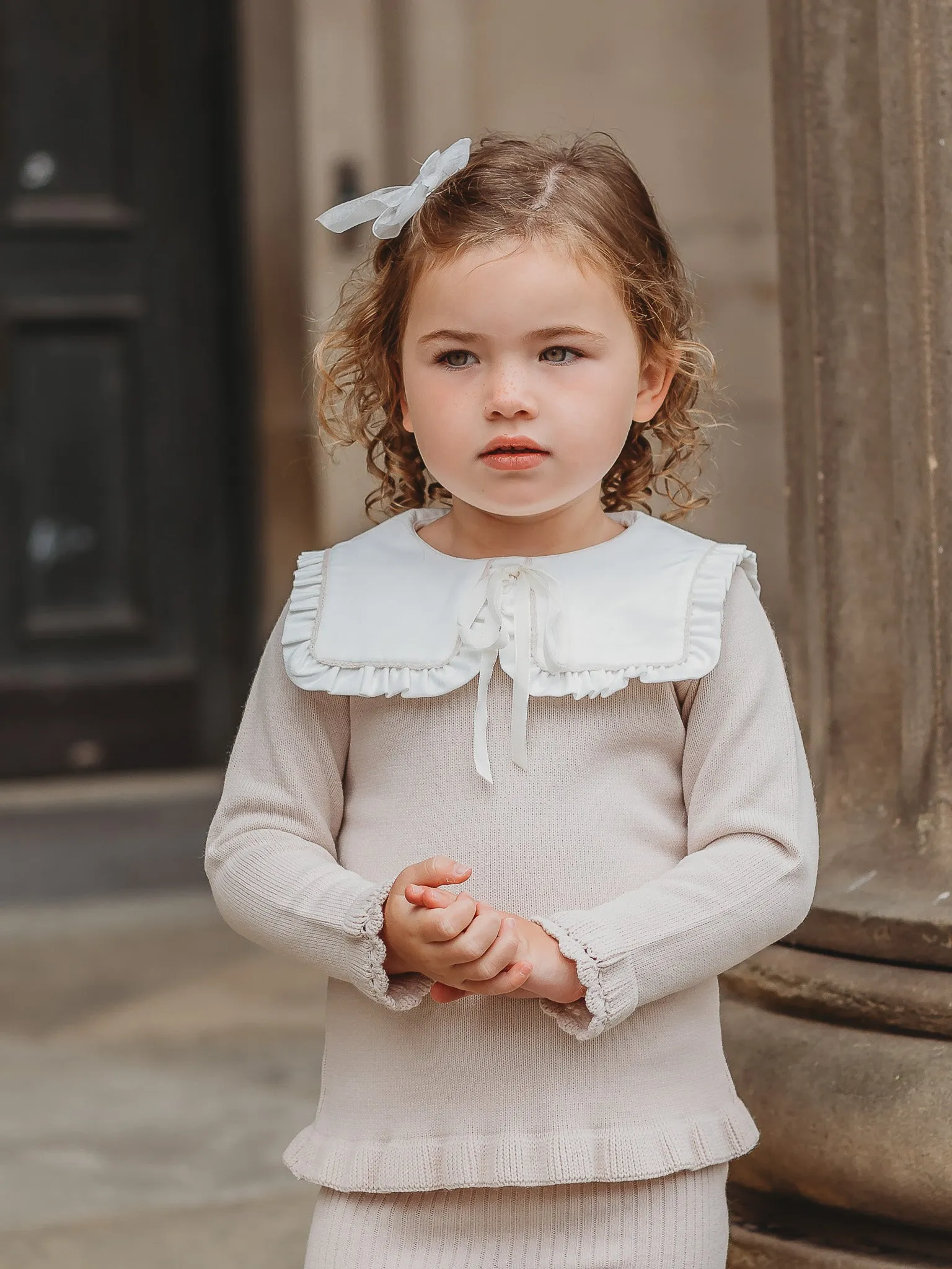 'Mabel' beige knitted suit with bib collar