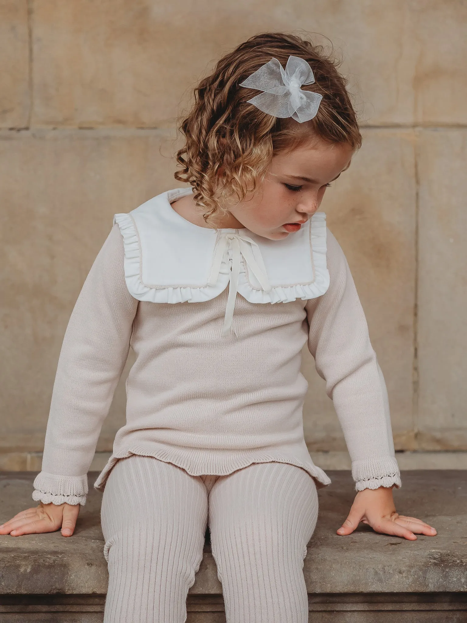 'Mabel' beige knitted suit with bib collar