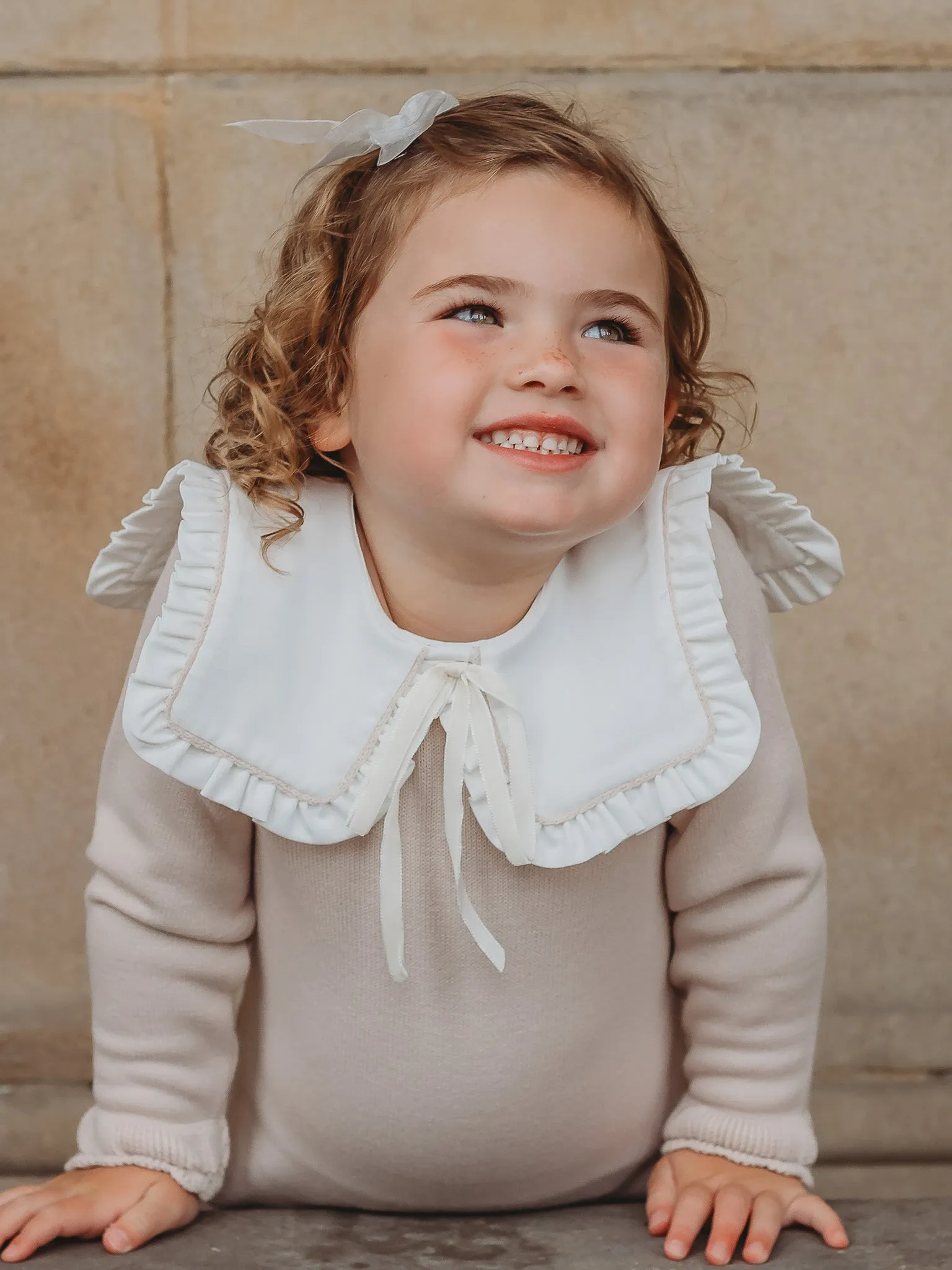 'Mabel' beige knitted suit with bib collar